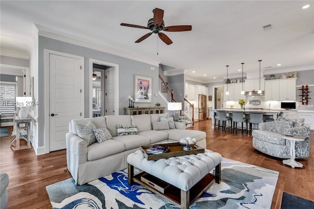 living room featuring crown molding, ceiling fan, and dark hardwood / wood-style floors