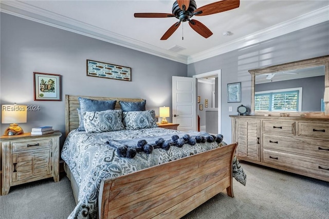 carpeted bedroom featuring crown molding and ceiling fan