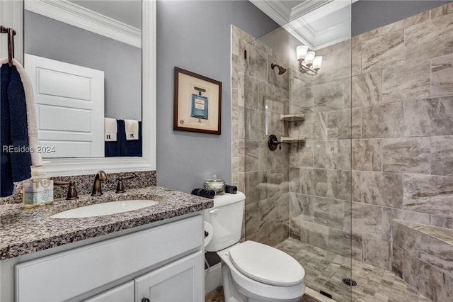 bathroom featuring crown molding, tiled shower, vanity, and toilet