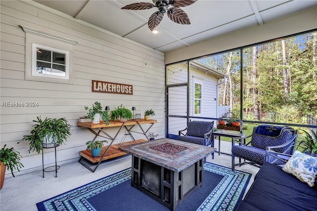 sunroom featuring ceiling fan