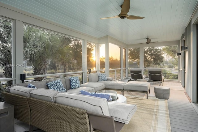 sunroom with wood ceiling, ceiling fan, and a wealth of natural light