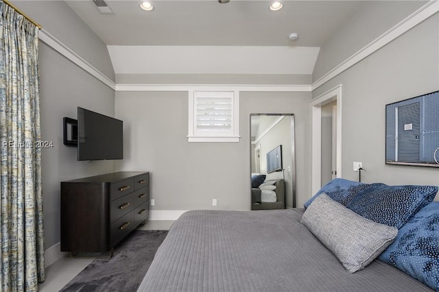 bedroom with lofted ceiling