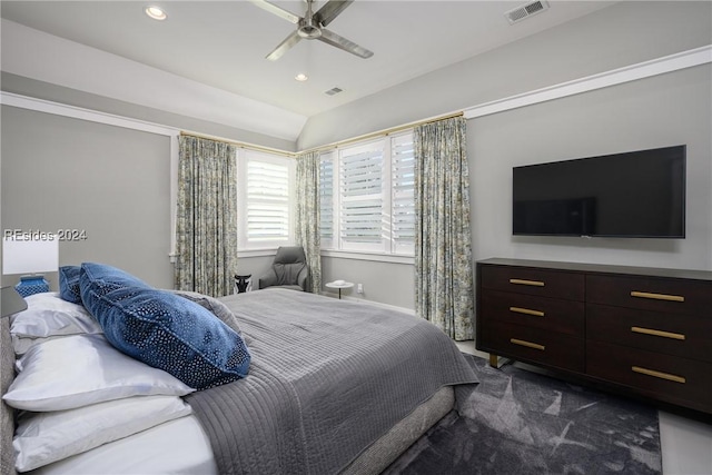 carpeted bedroom featuring ceiling fan and vaulted ceiling