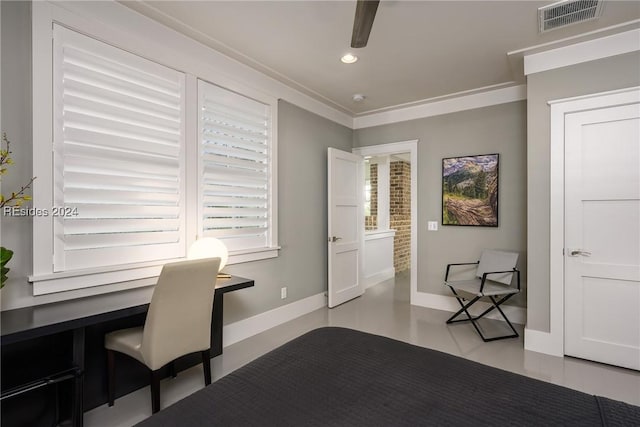 office space with ornamental molding and built in desk