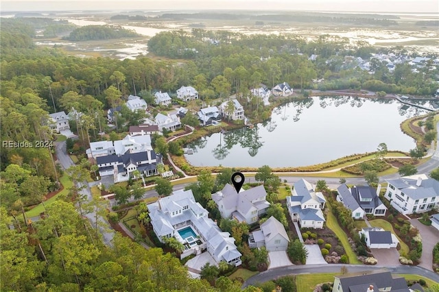 bird's eye view with a water view