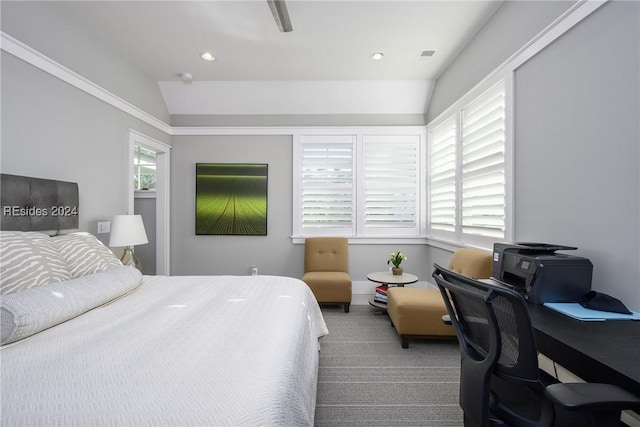 bedroom featuring ceiling fan, lofted ceiling, carpet floors, and multiple windows