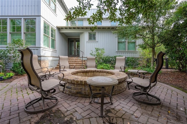 view of patio / terrace featuring an outdoor fire pit