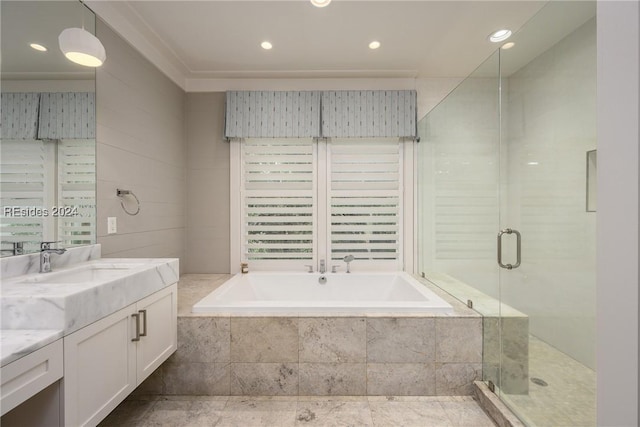 bathroom featuring vanity and shower with separate bathtub