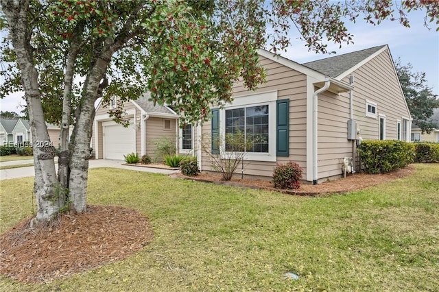 view of front facade with a garage and a front lawn