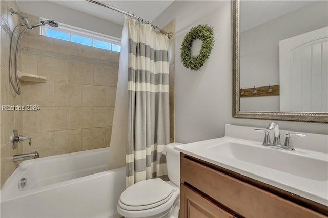 full bathroom featuring shower / tub combo, vanity, and toilet