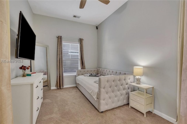 bedroom with ceiling fan and light colored carpet