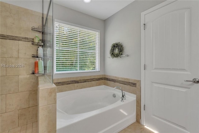 bathroom featuring separate shower and tub and tile patterned flooring