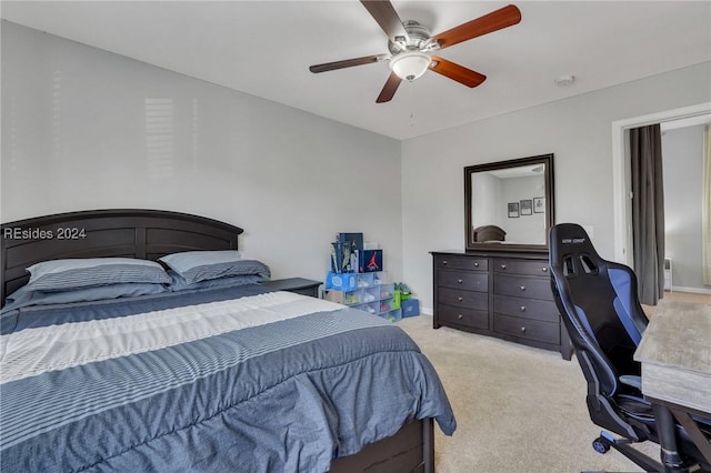 bedroom featuring ceiling fan and light colored carpet