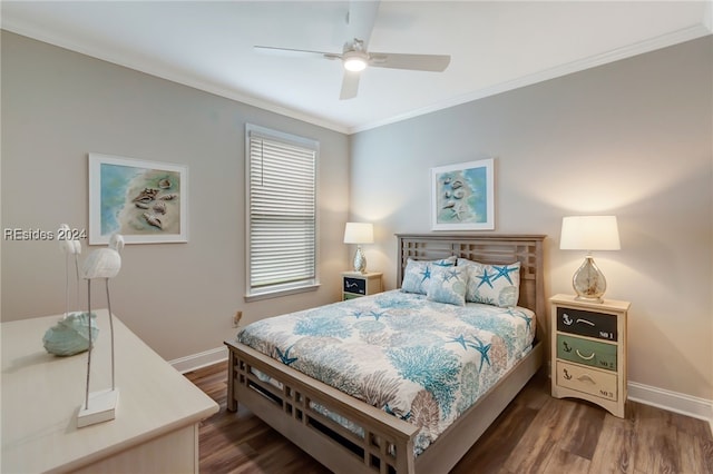 bedroom with dark wood-type flooring, ceiling fan, and crown molding