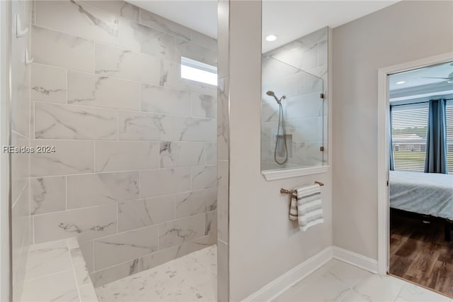 bathroom featuring a tile shower