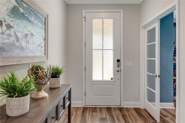 doorway with light wood-type flooring