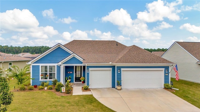 view of front of home featuring a garage and a front yard