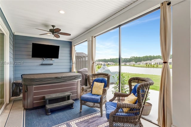 sunroom featuring ceiling fan