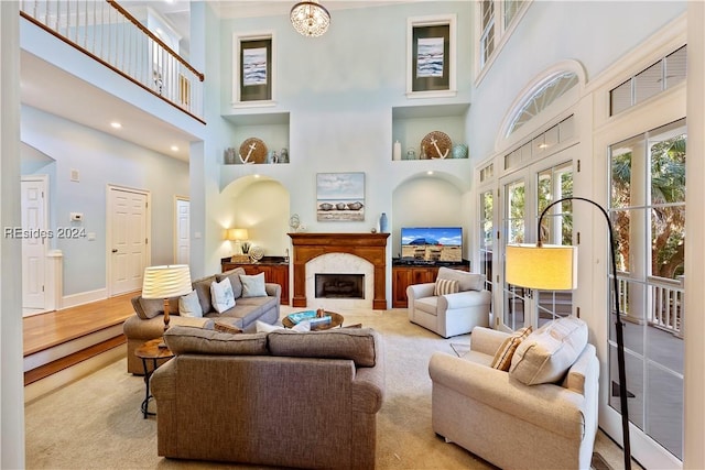 living room with a towering ceiling and french doors