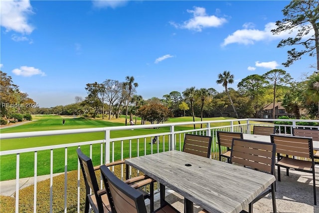 wooden terrace featuring a yard