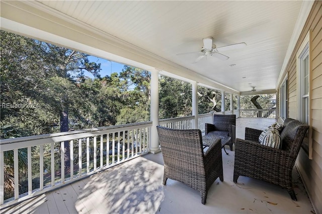 sunroom featuring ceiling fan