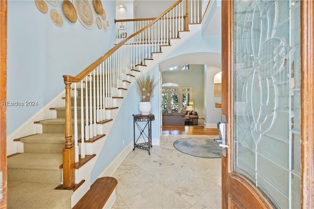 entryway with a high ceiling