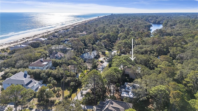 drone / aerial view with a beach view and a water view