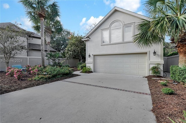 front facade with a garage