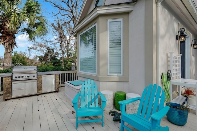 wooden deck featuring area for grilling