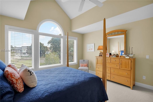 carpeted bedroom with vaulted ceiling and ceiling fan