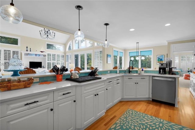 kitchen featuring dishwasher, a healthy amount of sunlight, sink, and white cabinets