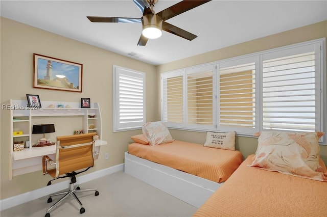 carpeted bedroom with ceiling fan