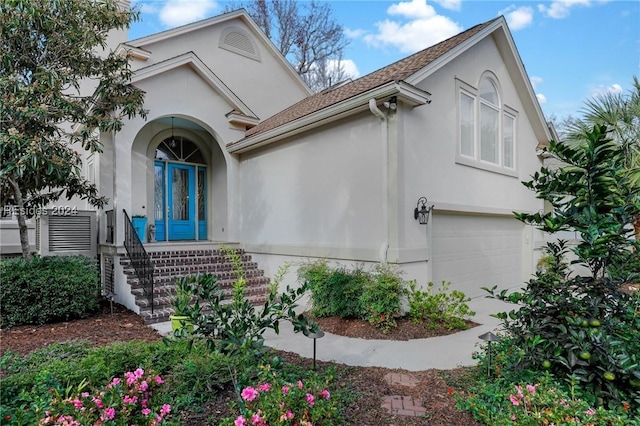 view of exterior entry featuring a garage