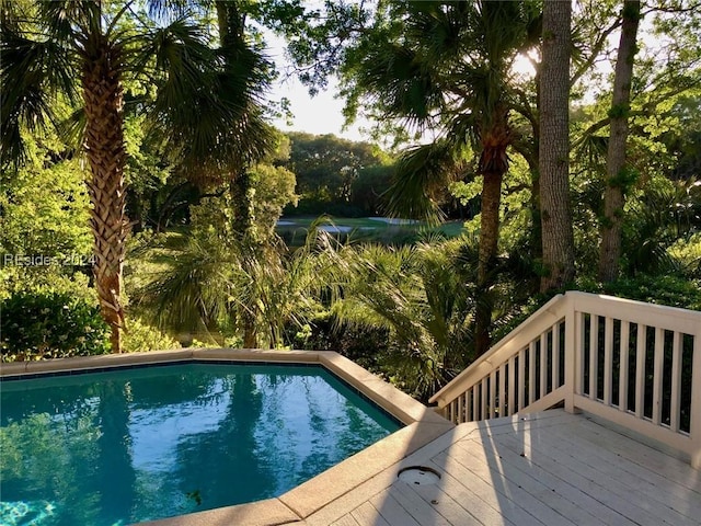 view of swimming pool featuring a wooden deck