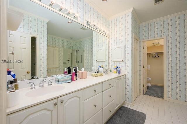 bathroom with crown molding, tile patterned flooring, vanity, a shower with shower door, and toilet