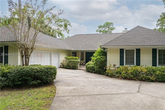 ranch-style house featuring a garage