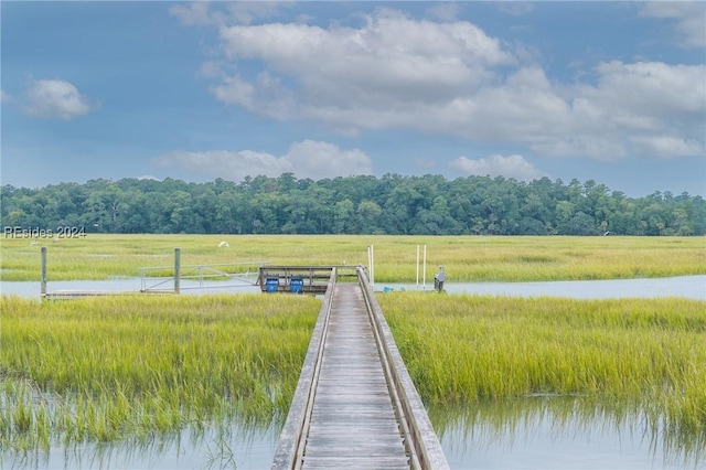 dock area with a water view and a rural view