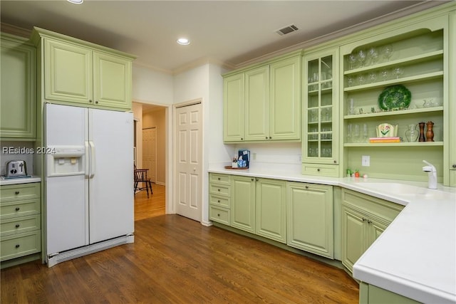 kitchen featuring ornamental molding, dark hardwood / wood-style flooring, sink, and white fridge with ice dispenser