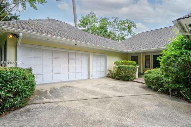 view of side of home with a garage