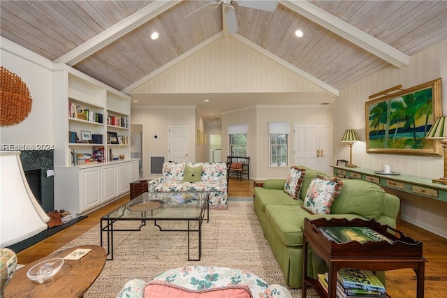 living room featuring vaulted ceiling with beams, light hardwood / wood-style flooring, wooden ceiling, and ceiling fan