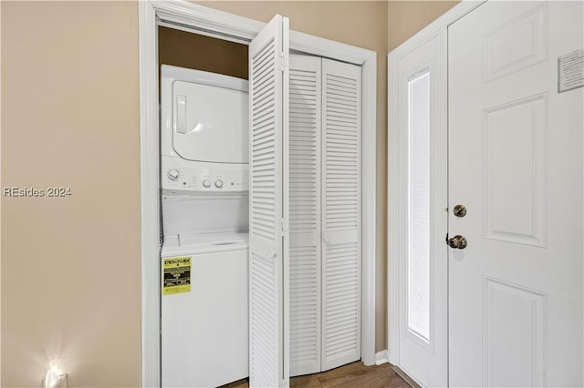 laundry area featuring stacked washer and clothes dryer