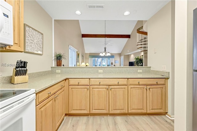 kitchen with light hardwood / wood-style floors, vaulted ceiling with beams, white appliances, and kitchen peninsula