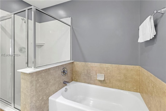 bathroom with independent shower and bath