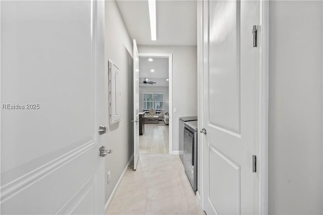 corridor with light tile patterned floors