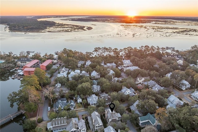 aerial view at dusk with a water view