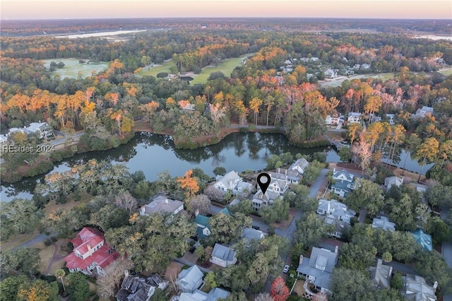 aerial view at dusk with a water view