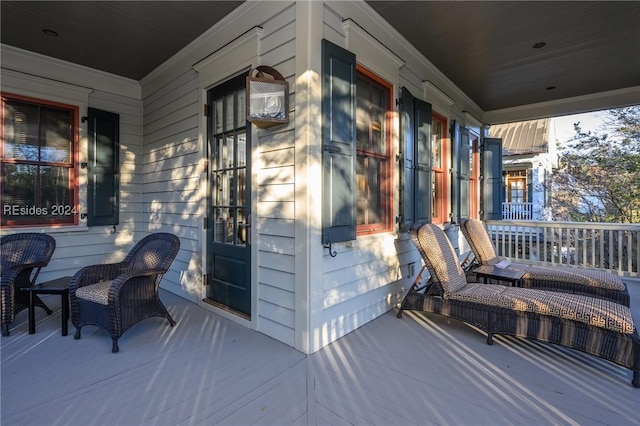 wooden deck featuring covered porch