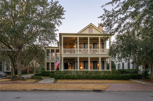 greek revival house with a balcony