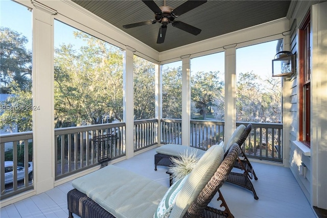 sunroom / solarium with ceiling fan