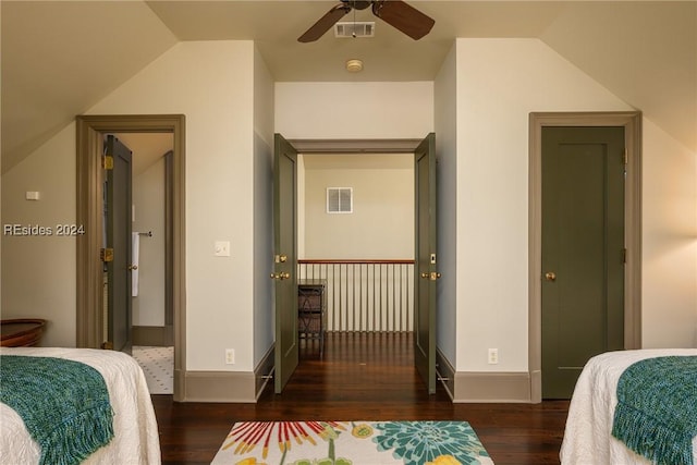 bedroom featuring lofted ceiling, dark wood-type flooring, and ceiling fan